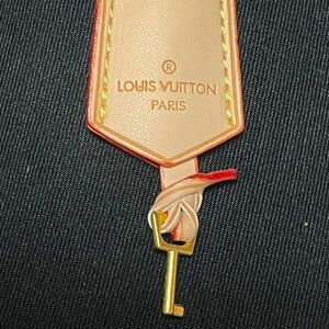 Louis Vuitton Epi Key in  Red and Tan Holder with strap. NWOT